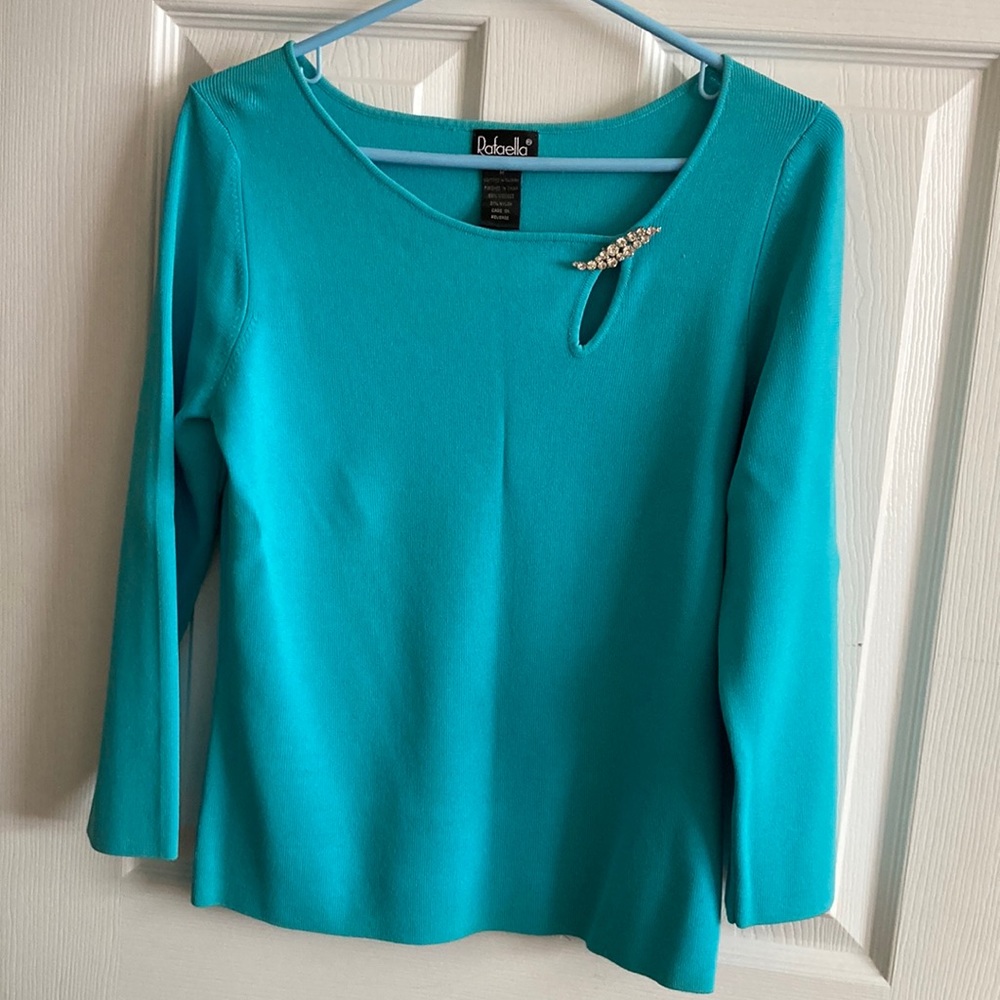 Aqua/teal color sweater. Size M